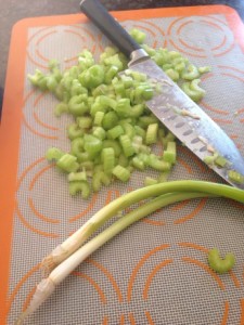 Chop celery and scallions into tiny pieces.